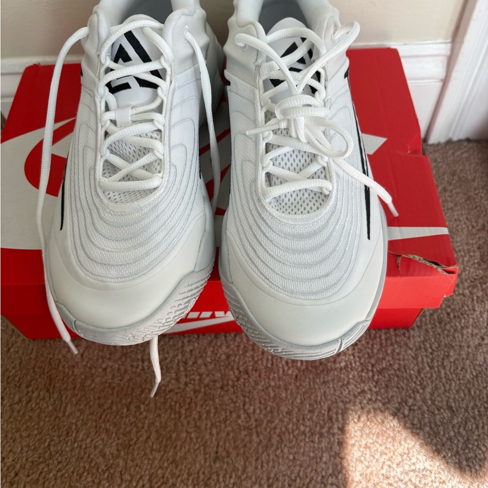 Nike White Sneakers with Black Swoosh Detail
